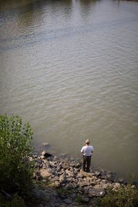 Full length of woman sitting in lake