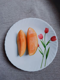 High angle view of fruits in plate on table