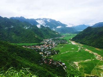 Scenic view of mountains against cloudy sky