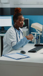 Female doctor working at clinic