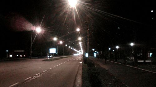 Street lights on road at night