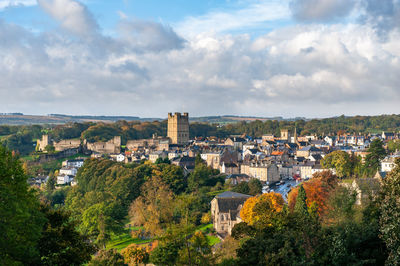 View of richmond castle, north yorkshire with the town in the foreground and autumn colours