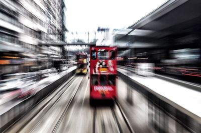 Blurred motion of car on illuminated city at night