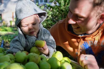 Close-up of father with cute daughter at market