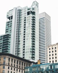 Low angle view of modern buildings against clear sky