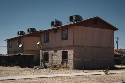 Abandoned building against clear sky