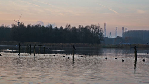 Scenic view of lake against sky during sunset