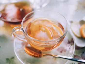 High angle view of tea with fruit slices in cup