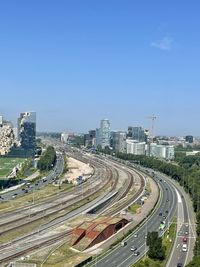 High angle view of cityscape against clear blue sky