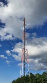 Low angle view of communications tower against sky