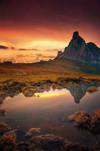 Scenic view of lake at sunset