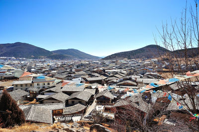 Townscape against clear blue sky
