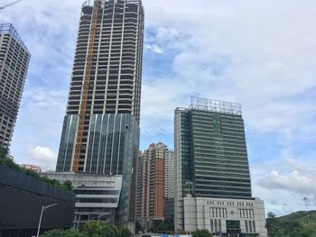 Low angle view of modern buildings against sky in city