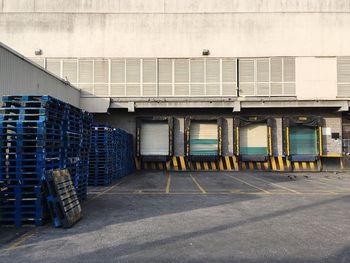 Stacked pallets on street outside factory