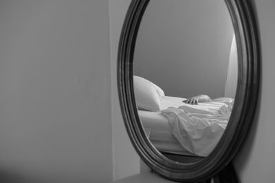 Close-up of mirror on wall at home