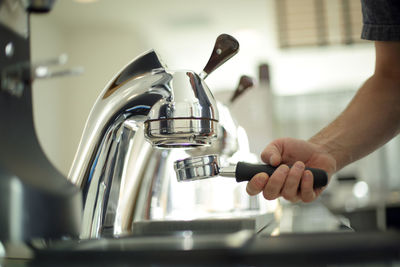 Midsection of man preparing food in kitchen