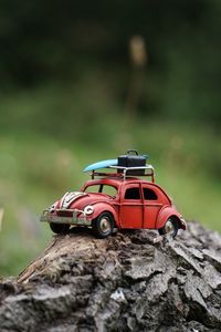 Close-up of toy car on rock