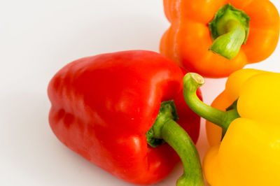 Close-up of bell peppers against white background