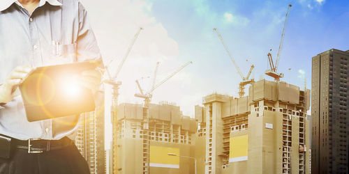 Panoramic shot of buildings against sky in city