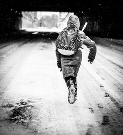 Full length of child in snow