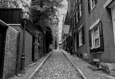 Street amidst buildings against sky