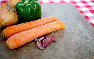 Close-up of fresh vegetables on cutting board