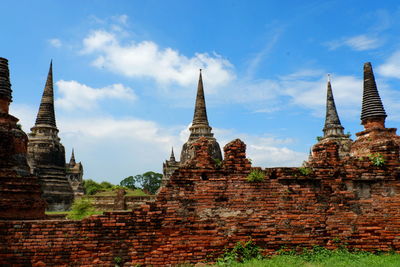 View of old temple building against sky