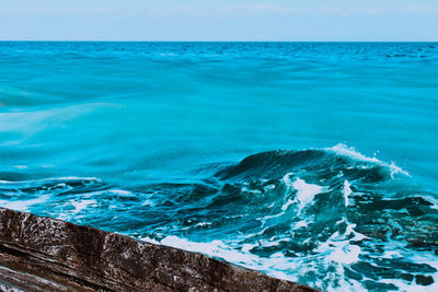 Close-up of sea against blue sky