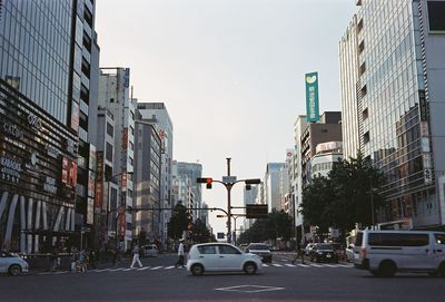 Traffic on city street against buildings