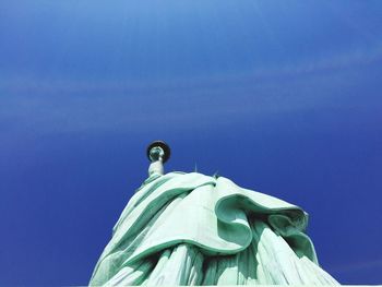 Low angle view of building against blue sky