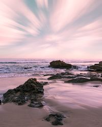 Scenic view of sea against sky at sunset