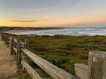 Scenic view of beach against sky during sunset
