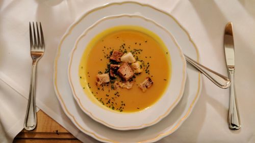 Directly above soup in bowl on table