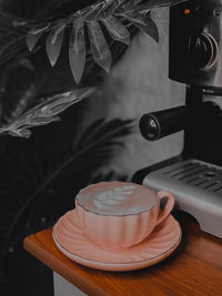 Close-up of coffee cup on table