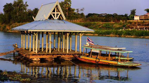 Lifeguard hut on lake against sky