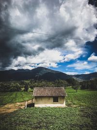 House on field against sky