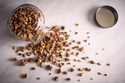 High angle view of coffee beans in glass on table