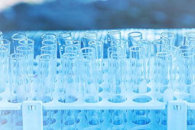 Close-up of empty test tubes in rack