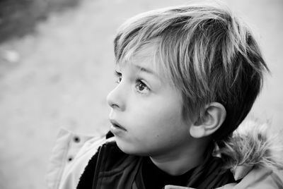 Close-up portrait of cute girl looking away