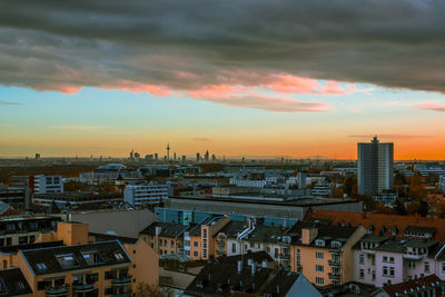 High angle view of buildings against sky during sunset