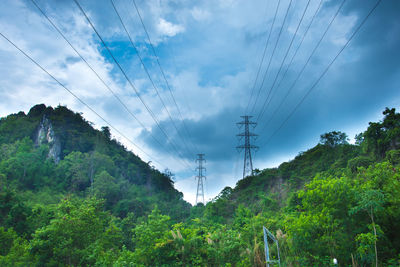 Low angle view of electricity pylon against sky