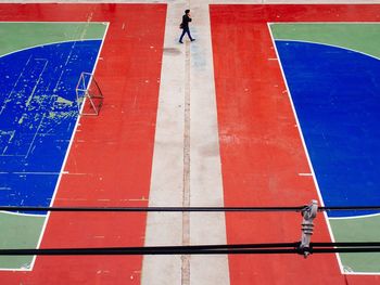 High angle view of man walking on court