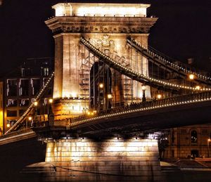 Illuminated bridge at night