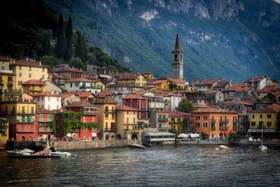 Townscape by sea against city
