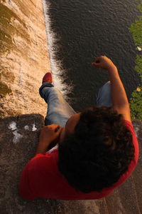 Low section of woman with reflection in water