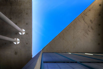 Low angle view of building against blue sky