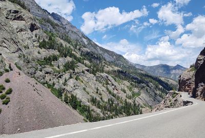 Road amidst mountains against sky