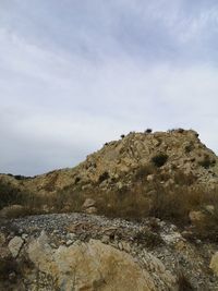 Rocks on land against sky