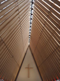 Low angle view of modern building - looking up at cross in church 