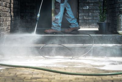 Low section of man working in water